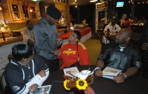 Former Chief player, Kevin Ross talks with fan 